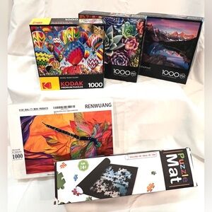 4- 1000 pc puzzles and a Puzzle Mat!
